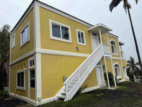 Yellow house with ocean view