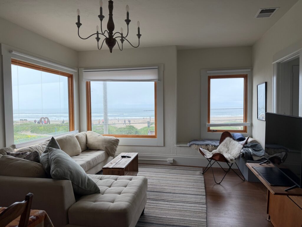 Spacious Living Room with Ocean View of Multifamily Residential Building