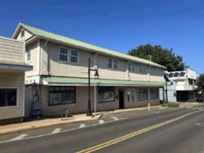 Exterior of mixed-use property in Wailuku HI with apartments and commercial unit